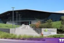 Exterior view of the modern NVIDIA corporate headquarters building with large glass facade and signage.