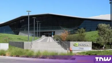 Exterior view of the modern NVIDIA corporate headquarters building with large glass facade and signage.