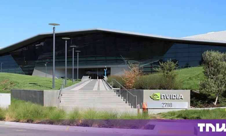 Exterior view of the modern NVIDIA corporate headquarters building with large glass facade and signage.