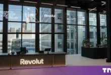 Revolut global headquarters reception desk with large windows overlooking Canary Wharf in London