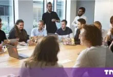 Diverse business team collaborating during a meeting in a modern bright boardroom
