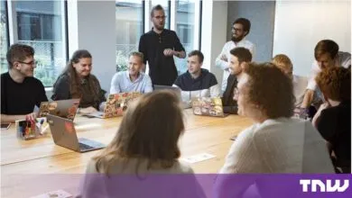 Diverse business team collaborating during a meeting in a modern bright boardroom