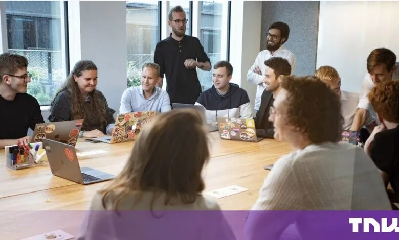 Diverse business team collaborating during a meeting in a modern bright boardroom