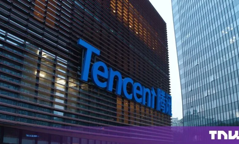 Blue Tencent logo displayed on the modern brown facade of the company headquarters building.