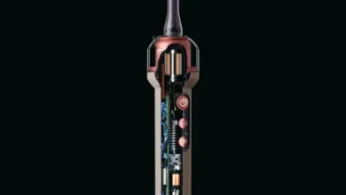 Cutaway view of an electric toothbrush exposing its internal motor, circuitry, and mechanical parts.