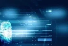 Glowing blue biometric fingerprint scanner with digital security data interfaces