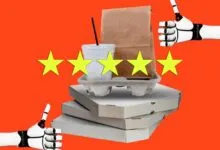 Robotic hands give thumbs up to a takeout meal of pizza boxes, paper bag, and drink against an orange background.