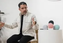 David Limp sitting on a chair and gesturing while presenting new Amazon Echo devices
