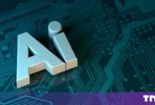 White 3D letters spelling AI resting on a teal circuit board with intricate traces.
