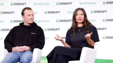 Jay Graber and another speaker on stage at TechCrunch Disrupt event