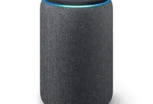 Charcoal gray Amazon Echo smart speaker with a glowing blue light ring around the top.