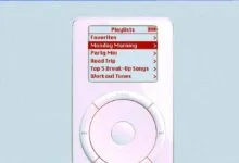 Close-up of a classic white iPod showing the playlists menu on its screen.