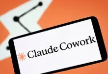 Smartphone displaying the Claude Cowork logo against an orange and white background.