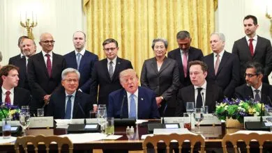 President Donald Trump speaks at a White House table surrounded by tech CEOs including Elon Musk and Mark Zuckerberg.