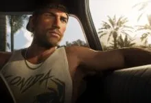 Jason Duval driving a car with palm trees visible outside the window in warm sunlight.