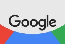 The dark grey Google logo centered over a background of red, blue, and green curves.