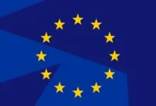 Stylized European Union flag with a dark blue geometric pattern and twelve gold stars in a circle.
