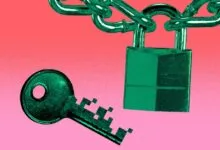 Green padlock hanging from a chain with a digital pixelated key below against a pink background