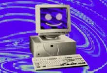 Retro computer with a glowing psychedelic smiley face on screen against a purple swirled background