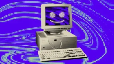 Retro computer with a glowing psychedelic smiley face on screen against a purple swirled background