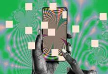 A hand holding a smartphone displaying a colorful, psychedelic fractal pattern against a green background.