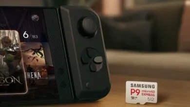 Samsung P9 MicroSD Express 512GB card placed beside a handheld gaming console.