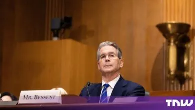 Scott Bessent sits behind a nameplate reading Mr. Bessent during a congressional hearing.