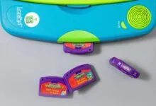 Top view of a turquoise LeapFrog LeapPad learning system with purple game cartridges.