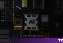 Close-up of a dark motherboard featuring a central chip stamped with the letters AI