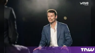 Alex Kendall, CEO of Wayve, seated on stage during an interview at the Wave by Vento event in Turin.