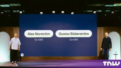 Spotify Co-CEOs Alex Norström and Gustav Söderström stand on stage below a large screen with their names.