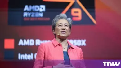AMD CEO Lisa Su speaking on stage in front of an AMD Ryzen branded backdrop