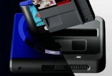 Modern retro gaming console with a Super Nintendo cartridge inserting into the top slot.