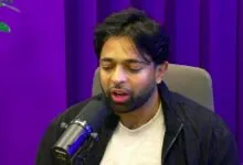 Thariq Shihipar speaking into a microphone during a podcast recording