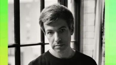 Portrait of comedian and filmmaker Nathan Fielder against a window with bright green side borders