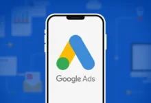 Smartphone displaying the Google Ads logo against a blue background with digital marketing icons.