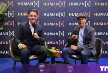 Cristian Dina interviewing Arvind Jain in front of a HUMANS[X] backdrop