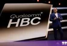 Qualcomm CEO Cristiano Amon presenting on stage in front of a giant Qualcomm HBC screen