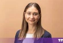 Portrait of Daniela Amodei, President and Co-founder of Anthropic, smiling gently