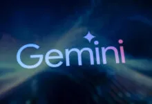 The glowing Google Gemini AI logo displayed on a dark blue screen with abstract colorful light patterns.