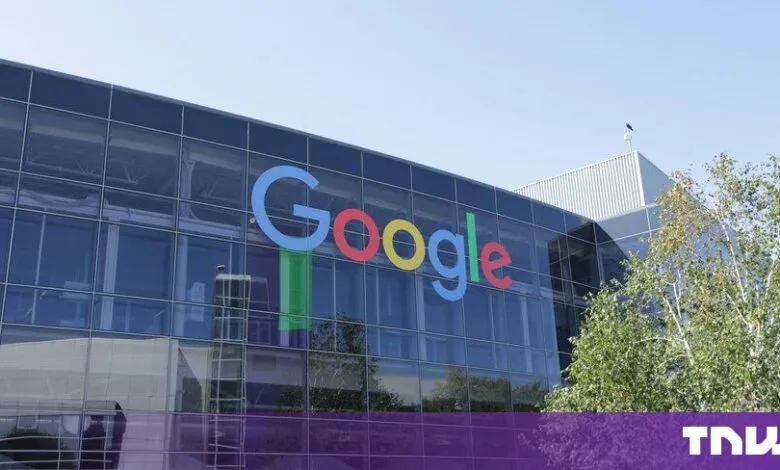 Modern glass-paneled Google headquarters building featuring the iconic colorful logo on the exterior facade.