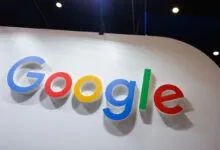 Dimensional Google logo displayed on a clean white wall at an exhibition or tech event.