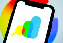 Google Search Console logo displayed on a smartphone screen against a colorful background