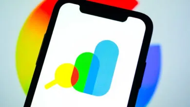 Google Search Console logo displayed on a smartphone screen against a colorful background