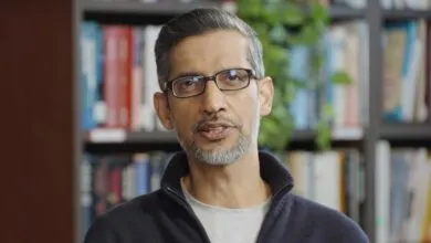 Google CEO Sundar Pichai speaks in front of a bookshelf