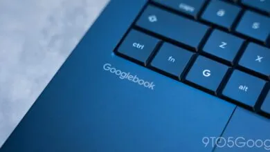 Close-up of a blue Googlebook laptop showing the keyboard and logo.