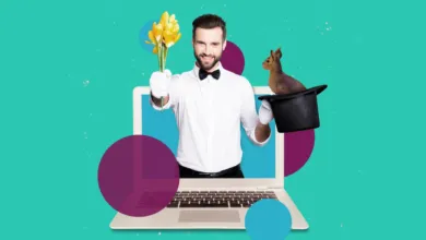 A smiling magician pops out of a laptop holding yellow flowers and a top hat with a rabbit.