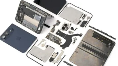 Disassembled smartphone parts laid out neatly on a clean white background.
