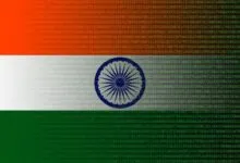 Indian flag overlaid with matrix-style green and red digital code and numbers