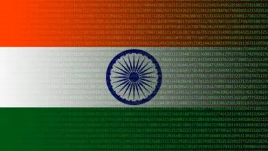 Indian flag overlaid with matrix-style green and red digital code and numbers
